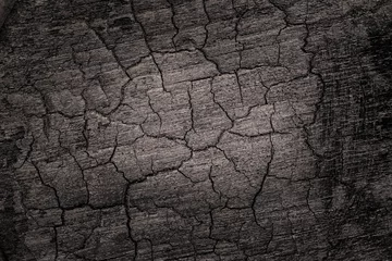 Fotobehang  Burnt wooden Board texture. Burned scratched hardwood surface. Smoking wood plank background © nnattalli