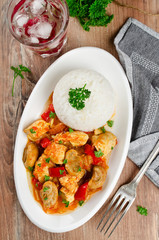 Chicken stew with mushrooms served  with rice