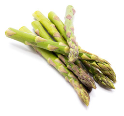 Bunch of raw asparagus with two crossed isolated on white background