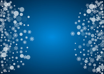 Christmas frame with falling snow on blue background. Horizontal Merry Christmas frame with white frosty snowflakes for banners, gift cards, party invitations and special business offers.