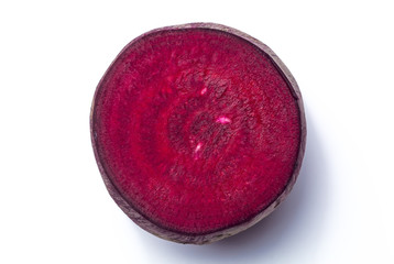Cut red beet on white background.