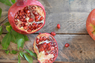 Apple and pomegranate for traditional holiday symbols rosh hashanah (jewesh holiday) on black background