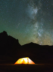 Red tent in the mountains (Cerces, France) under the stars and milky way.