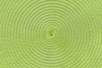 Fototapeta na wymiar green circular pattern background of wicker napkin