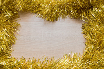 Christmas New Year holiday background. Golden tinsel.  Copy space
