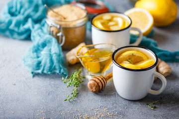 Cups of ginger tea with honey and lemon