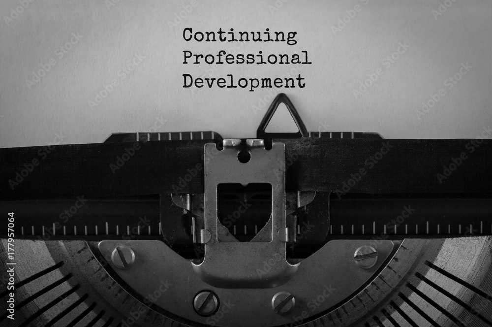 Aufkleber Text Continuing Professional Development typed on retro typewriter