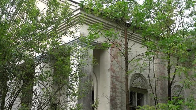 Chernobyl, Ukraine - 17th of June 2017: Visit to Zalesye village in Chernobyl zone - 4K Front view on the cultural house in Chernobyl zone