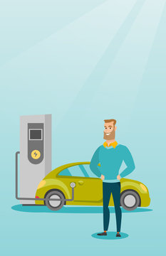 Young caucasian man charging electric car at charging station. Man standing near power supply for electric car. Charging of electric car. Vector flat design illustration. Vertical layout.