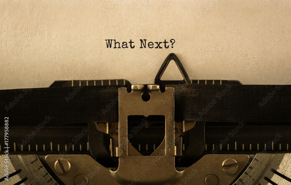 Fototapete text what next typed on retro typewriter