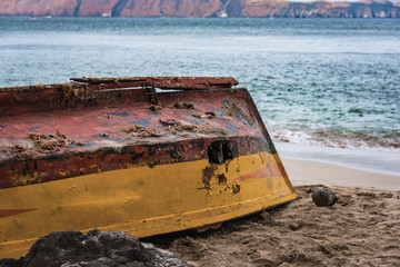 Fishing boat left on the beach in Paracas, Peru.