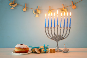 image of jewish holiday Hanukkah background with traditional spinnig top, menorah (traditional candelabra)