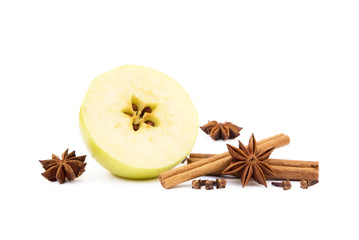 Aromatic apple, star anise, cloves and cinnamon isolated on white background