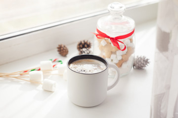 Gingerbread cookies and cup of coffee with new year sweets