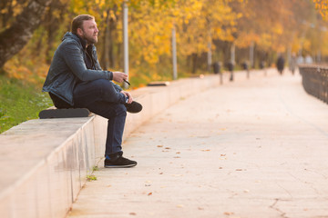 Obraz premium Man in park in autumn time