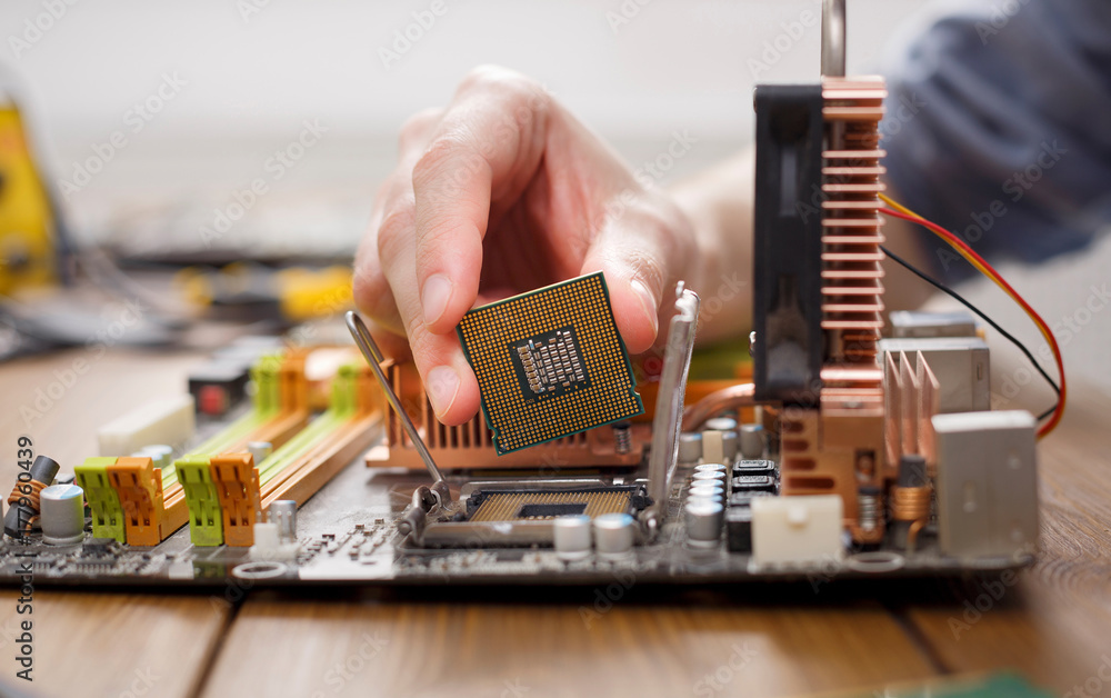 Poster Technician plug in microprocessor to motherboard