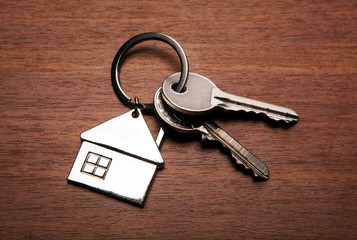 keys from the apartment with a keychain in the form of a house