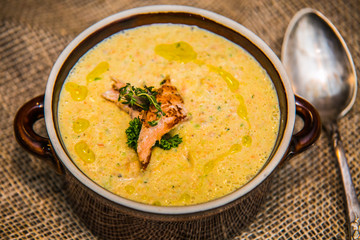 fish creme soup on a wooden table.