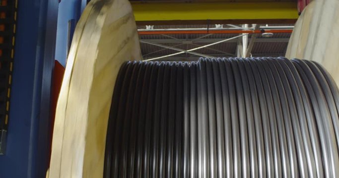 Industrial cable production. Winding the cable onto the reel.