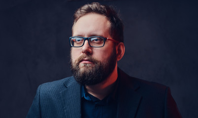 Fototapeta premium Serious plump male in eyeglasses over grey background.