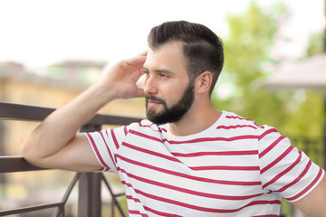 Handsome man in casual clothes outdoors