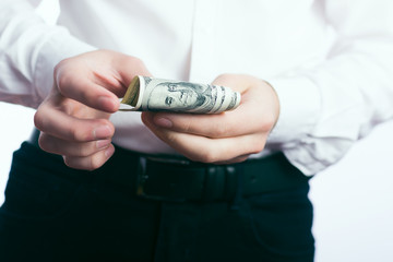 One hundred dollar bills in the hands