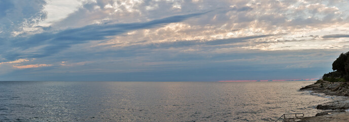 Fototapeta na wymiar Sunset over Adriatic Sea with dramatic sky panorama