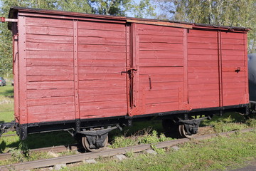 Fototapeta na wymiar Old wooden freight wagon. Part of destroyed train.