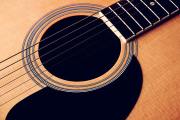 Close Up shot photo of Classic acoustic guitar with filter effect retro vintage style