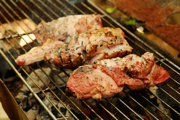 medium roasted  steak  pork on iron grill.Thailand local tradition grill pork