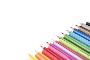Colorful markers and pencils on white background