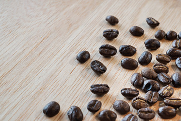 close up of Coffee beans on wood background, selective focus (detailed close-up shot)