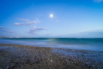 sunset over a beach on a warm day