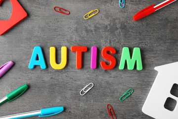 Word "Autism" on grey background