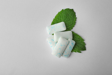 Mint chewing gum on light background