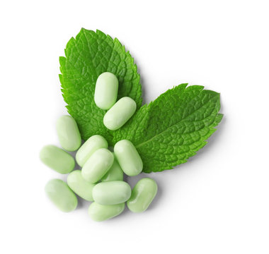 Delicious hard mint candies on white background