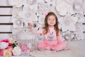 doll girl with brunnete hair stylish dressed in pink dress pinky skirt shirt happyly smiling posing...