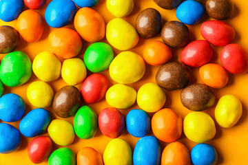 Colorful candies on bright background