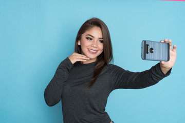 Hispanic Girl Taking Selfie