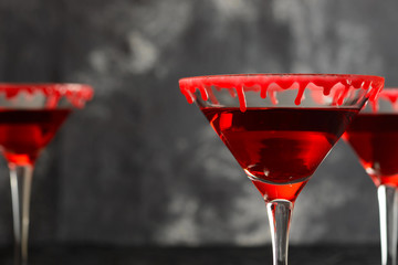 Halloween cocktail with bloody rim on the dark background