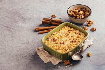 Apple crumble dessert with cinnamon and walnuts