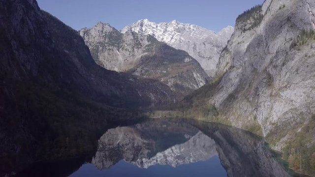 Flight over calm Obersee Lake in the Berchtesgaden National Park, Bavaria, Germany. Original untouched LOG format.