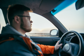 man driving car in fog