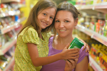 Mother and daughter choosing products