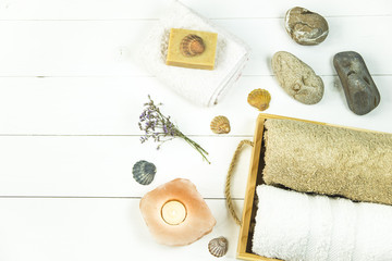 wooden tray with accessories for spa procedures with a floppy, candles and soap. Flat lay. Top view
