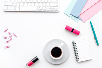 notebook, cosmetics and flowers for female home office on white background top view copyspace