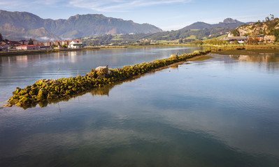 The Sella river arriving at its mouth in the Cantabrian sea in Ribadesella, northern Spain