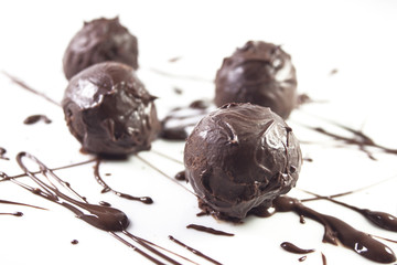 Chocolate truffles over white background