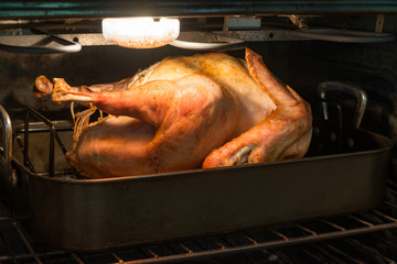 Naklejka premium Fresh turkey roasting in an oven