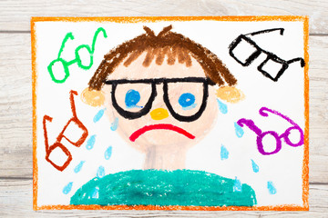 Photo of colorful drawing: Sad and crying boy with his grasses. Defect of vision.